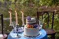 Romantic wedding dinner, in the Park by the water. Lots of green. Table for a romantic wedding dinner, date. The Park by Royalty Free Stock Photo