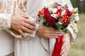 Romantic Wedding Embrace with Bridal Bouquet Royalty Free Stock Photo