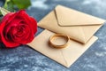 The romantic wedding proposal includes a ring, a rose, and an envelope to make the moment perfect Royalty Free Stock Photo