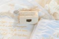 Romantic wedding set featuring gold wedding bands and a wooden box Royalty Free Stock Photo