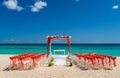 Romantic Wedding setting up with red decorations on the beach Royalty Free Stock Photo