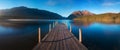 Romantic wharf on Lake Rotoiti, view ovelooking misty Saint Arnaud Ridge, all part of Nelson Lakes National Park in north od South