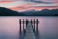 Romantic wharf on Te Anau on South Island of New Zealand Beautiful pier on sunrise. Lake Te Anau is the largest lake.