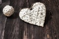Romantic, white heart and sphere on dark wood Royalty Free Stock Photo