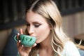 Romantic woman with coffee cup. Closeup portrait of woman with cup coffee. Coffee. Beautiful Girl Drinking Tea. Model is Royalty Free Stock Photo