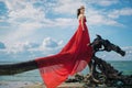 Romantic woman in fluttering red dress Royalty Free Stock Photo