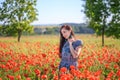 Romantic woman in sundress on poppy field Royalty Free Stock Photo