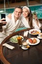 Couple in love taking selfie in wellness center