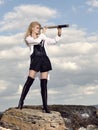 Romantic young beautiful girl with a spyglass. Royalty Free Stock Photo