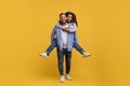 Romantic Young Black Man Piggybacking His Cheerful Girlfriend, Having Fun Together Royalty Free Stock Photo