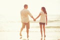 Romantic Young Couple on the Beach at Sunset Royalty Free Stock Photo