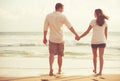 Romantic Young Couple on the Beach at Sunset Royalty Free Stock Photo