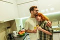 Young couple cooking together in the kitchen,having a great time together, drink wine