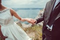 Romantic young couple enjoying sun near river