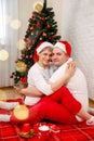 Romantic young couple exchanging Christmas gifts. Winter holidays Royalty Free Stock Photo