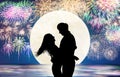 Romantic young Couple hug on the beach and fireworks background Royalty Free Stock Photo