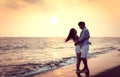 Romantic young Couple hug on the beach at sunset Royalty Free Stock Photo