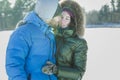 Romantic young couple hugging outdoor in winter frosty day Royalty Free Stock Photo