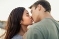 Romantic young couple kissing each other outside in the afternoon Royalty Free Stock Photo