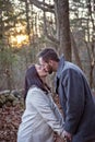 Romantic young couple kissing in the New England woods Royalty Free Stock Photo