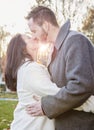 Romantic young couple kissing outside on a cold fall day Royalty Free Stock Photo