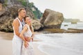 Romantic couple looking into distance by the ocean Royalty Free Stock Photo