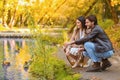 Romantic young couple looking at ducks at park Royalty Free Stock Photo