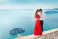 Romantic young couple in love over sea shore background. Fashion Royalty Free Stock Photo