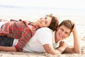 Romantic Young Couple Relaxing On Beach Royalty Free Stock Photo