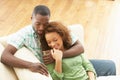 Romantic Young Couple Relaxing Sitting On Sofa Royalty Free Stock Photo