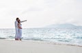 Romantic young couple on the sea shore Royalty Free Stock Photo