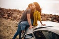 Romantic young couple sharing a special moment while outdoors. Young couple in love on a road trip. Couple embracing Royalty Free Stock Photo