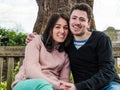 Romantic Young Couple Sitting On Park Bench Together Royalty Free Stock Photo