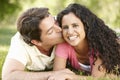 Romantic Young Hispanic Couple Relaxing In Park Royalty Free Stock Photo