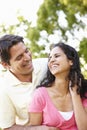 Romantic Young Hispanic Couple Relaxing In Park Royalty Free Stock Photo