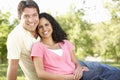 Romantic Young Hispanic Couple Relaxing In Park Royalty Free Stock Photo