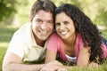 Romantic Young Hispanic Couple Relaxing In Park Royalty Free Stock Photo