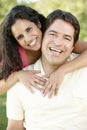 Romantic Young Hispanic Couple Relaxing In Park Royalty Free Stock Photo