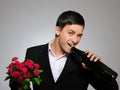 Romantic young man with flowers on a date