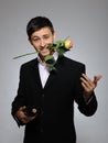 Romantic young man with flowers on a date