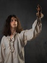 romantic young man in a medieval costume makes a speech. Royalty Free Stock Photo