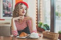 Romantic young woman in european cafee Royalty Free Stock Photo