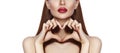 Romantic young Woman making Heart Shape with her Fingers. Love and Valentines Day Symbol. Fashion girl with Happy Smile Royalty Free Stock Photo