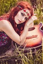 Romantic youth girl travelling with her guitar. Hippie style. Royalty Free Stock Photo