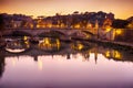 Rome bridge with Tiber river view at dusk