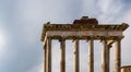 Rome - The columns of the Temple of Saturn and overview of the ancient ruins of the Roman Forum Royalty Free Stock Photo