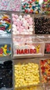 Display wall of Haribo candies of various flavors for sale by weight. Bonn-based German confectionery company