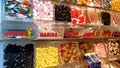 Display wall of Haribo candies of various flavors for sale by weight. Bonn-based German confectionery company