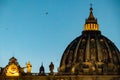 Rome - Flock of birds flying  over illuminated facade of the Saint Peter Basilica in the Vatican City, Rome, Italy Royalty Free Stock Photo