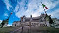 Rome - Italian national flag with scenic view on the front facade of Victor Emmanuel II monument on Piazza Venezia in Rome Royalty Free Stock Photo